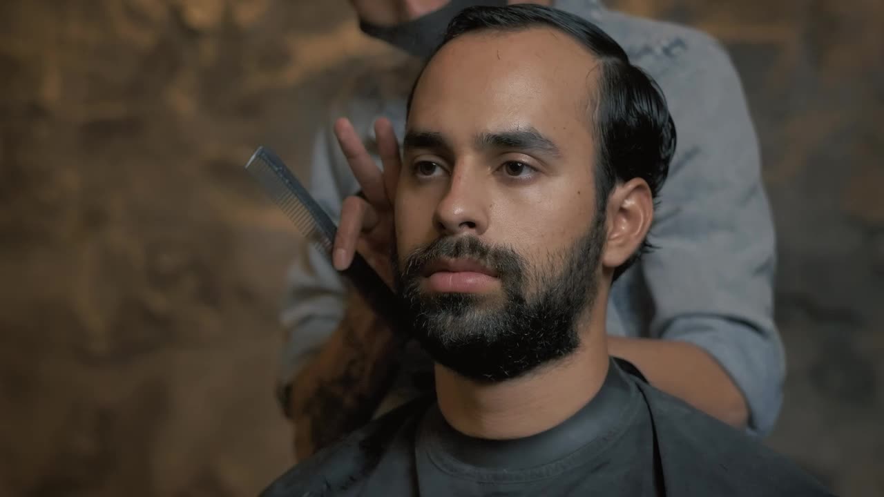 Download Video Stock Portrait Of A Man During A Haircut Live Wallpaper Free