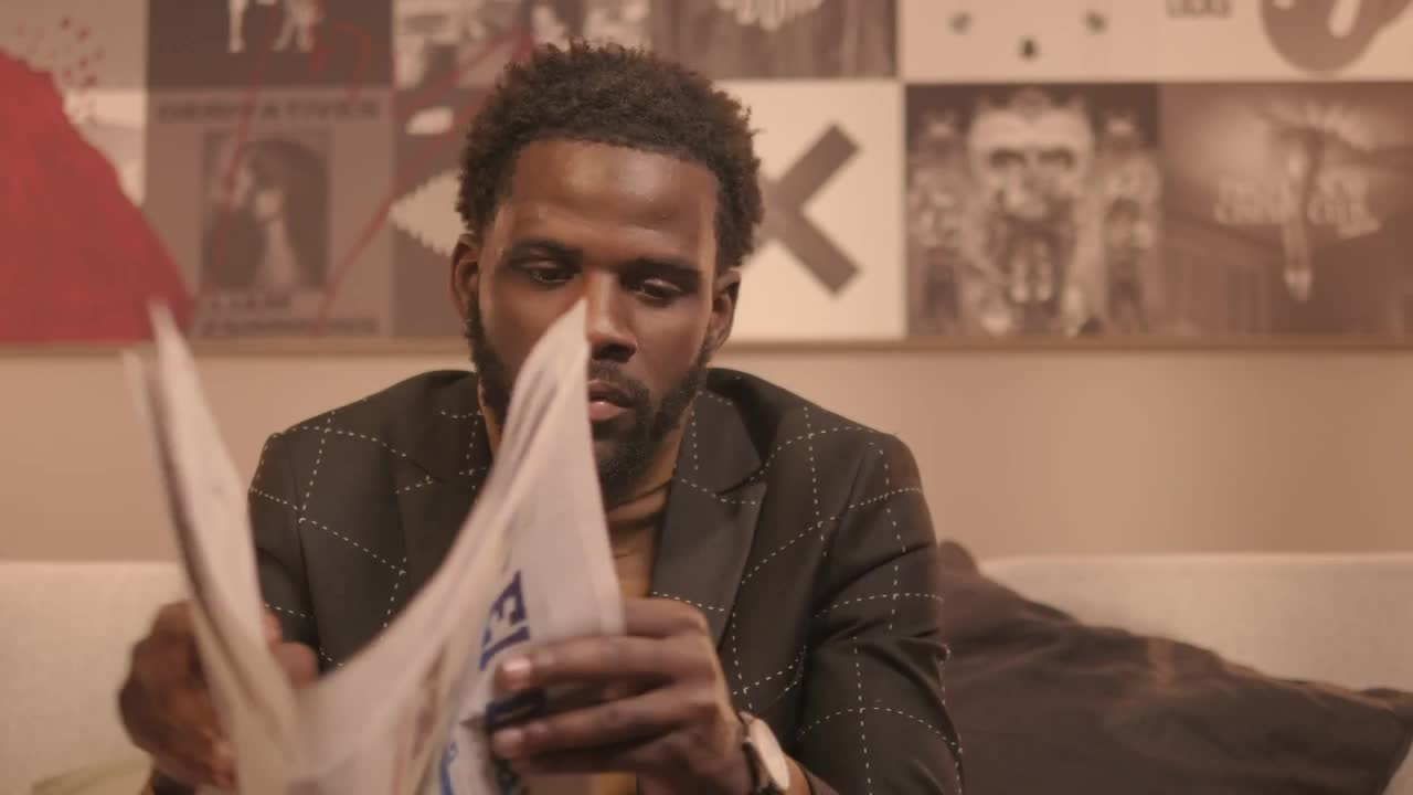 Download Video Stock Portrait Of A Man Leafing Through A Newspaper Live Wallpaper Free