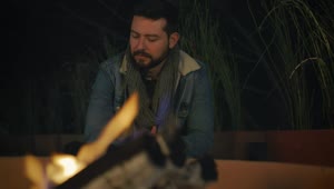 Video Stock Portrait Of A Man Warming His Hands By A Campfire Live Wallpaper Free