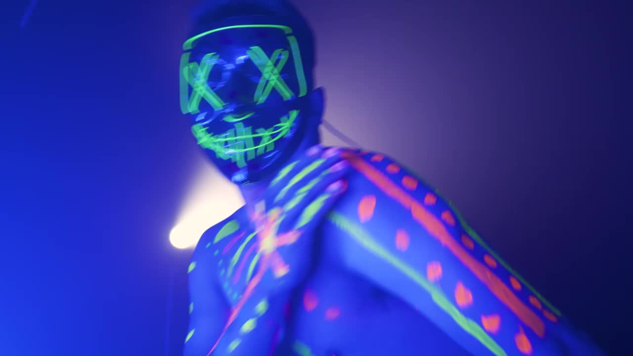 Download Video Stock Portrait Of A Man With Mask Dancing Energetically Live Wallpaper Free