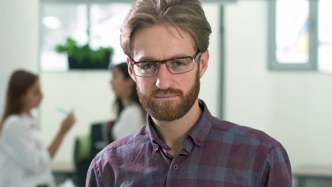 Download Video Stock Portrait Of A Young Man Looking At The Camera Live Wallpaper Free