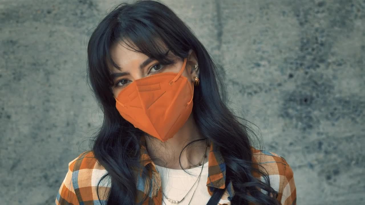 Download Video Stock Portrait Of A Young Woman With Face Mask Live Wallpaper Free