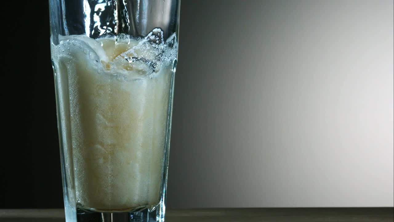 Download Video Stock Pouring Beer Into A Glass In Slow Motion Live Wallpaper Free