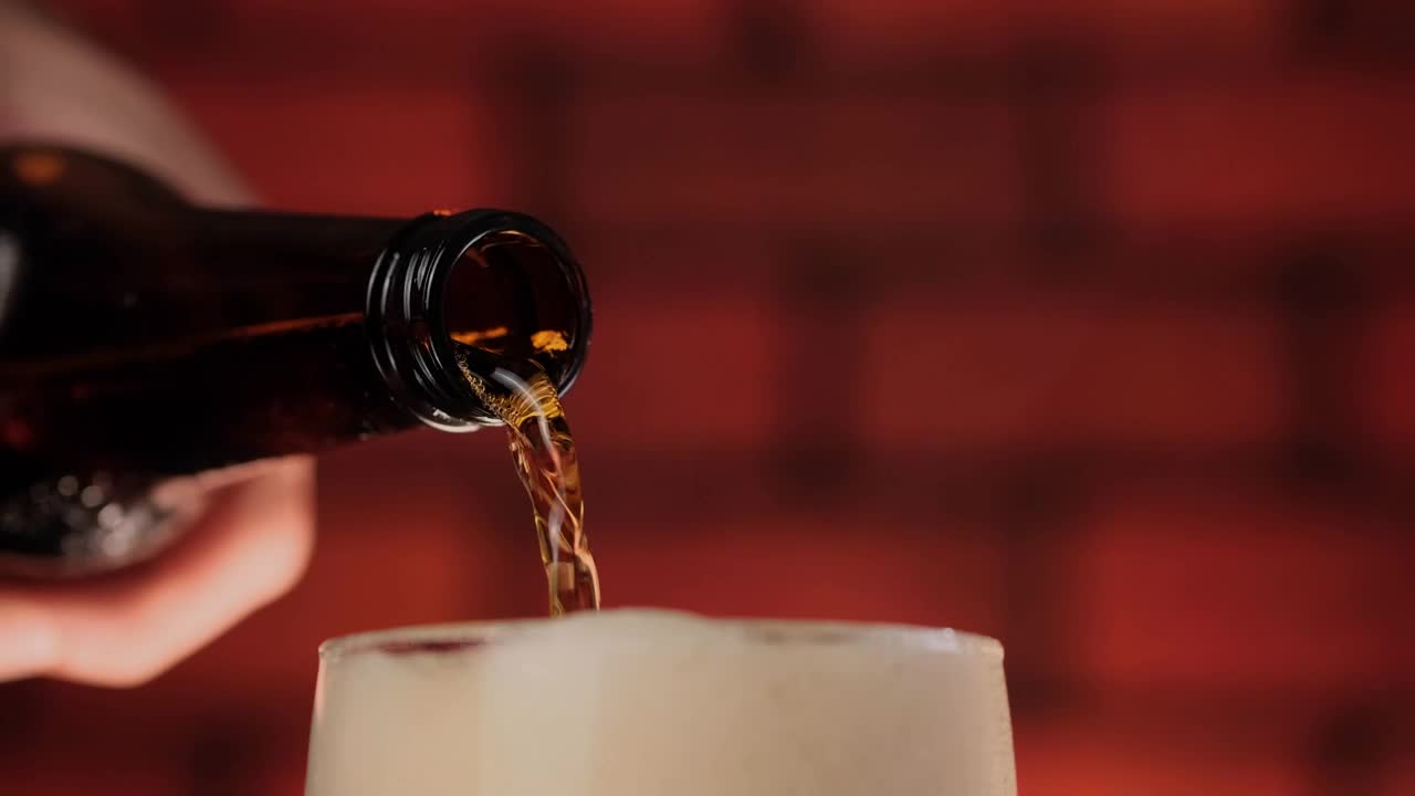 Download Video Stock Pouring Beer Into A Glass While The Foam Overflows Live Wallpaper Free