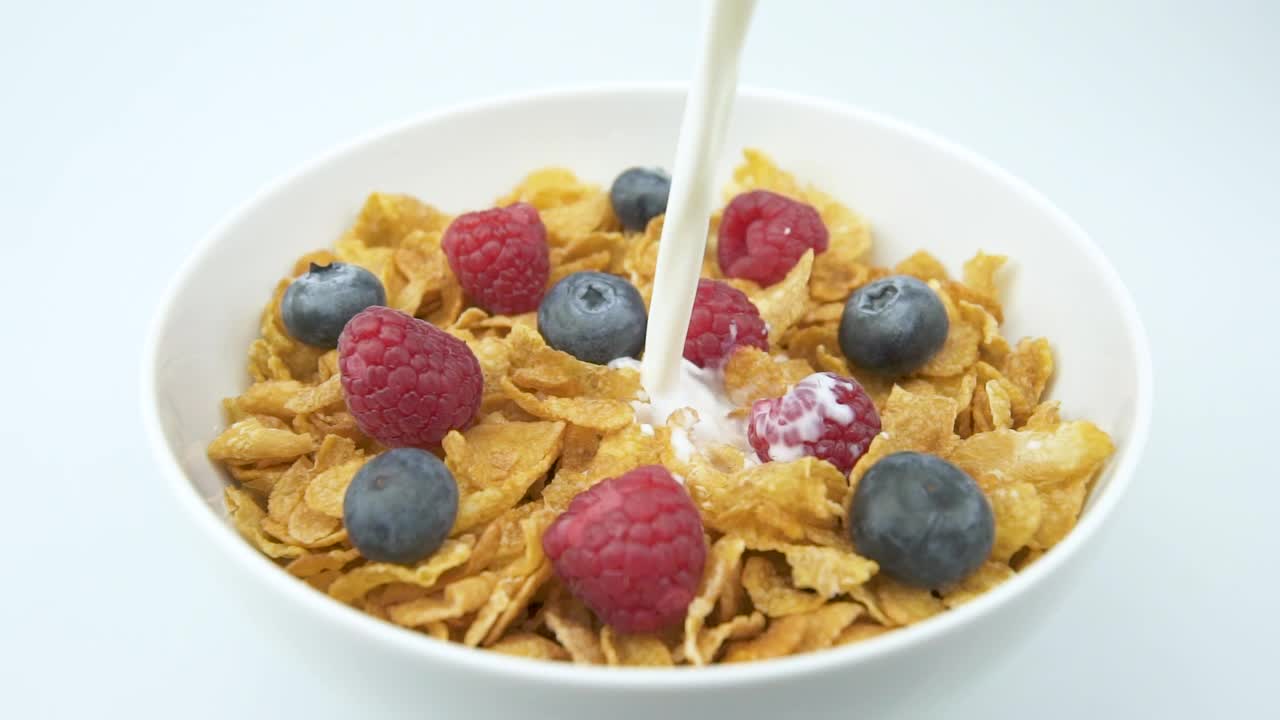 Download Video Stock Pouring Fresh Milk Over A Bowl Of Cereal Live Wallpaper Free
