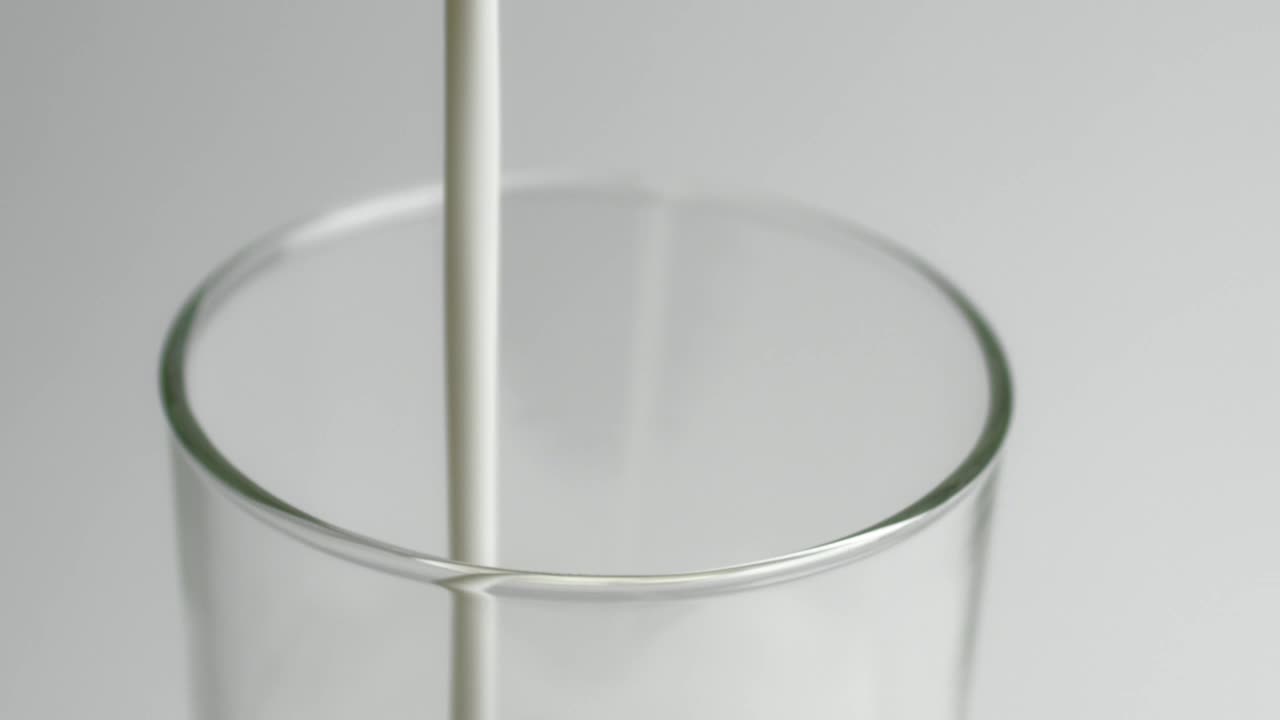 Download Video Stock Pouring Milk In A Glass Close Up Live Wallpaper Free