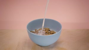 Video Stock Pouring Milk Into A Bowl With Chocolate Flavored Cereal Live Wallpaper Free