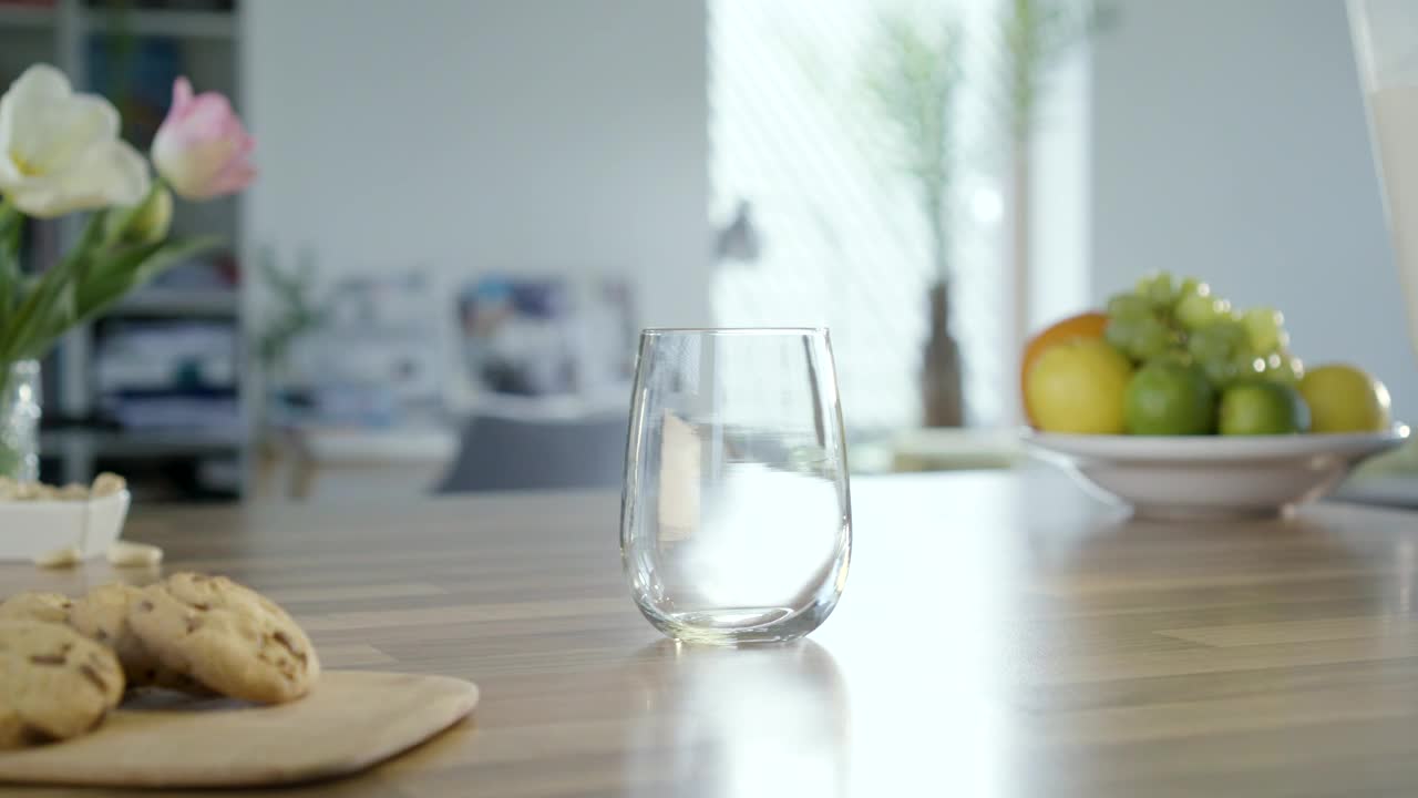 Download Video Stock Pouring Milk Into A Glass On The Table Live Wallpaper Free