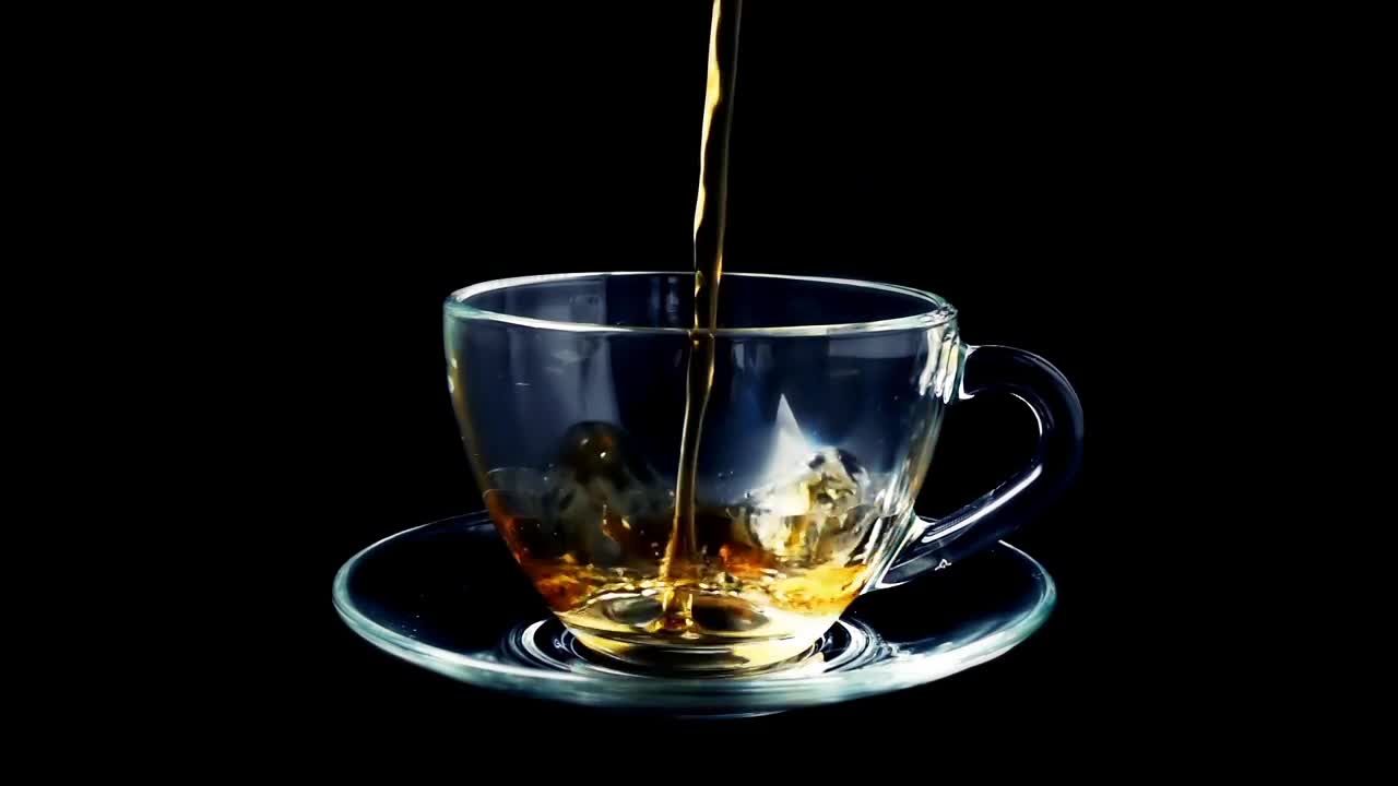 Download Video Stock Pouring Tea Into A Glass Cup Live Wallpaper Free