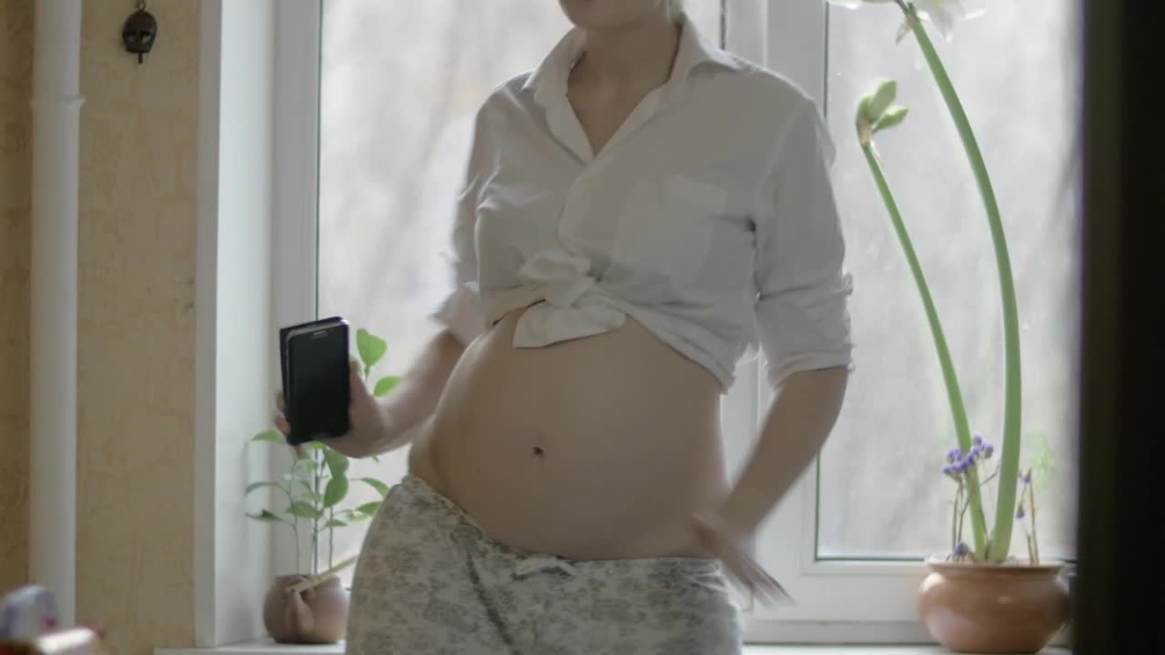 Download Video Stock Pregnant Woman Dancing Around Live Wallpaper Free