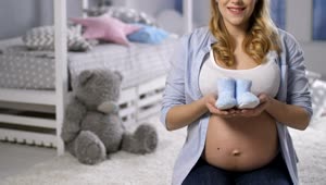 Video Stock Pregnant Woman Holding Baby Shoes Live Wallpaper Free