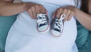 Video Stock Pregnant Woman Holding Small Baby Shoes Top Shot Live Wallpaper Free