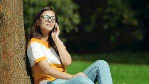 Video Stock Pretty Girl In Glasses Says Hello On Mobile In Park Live Wallpaper Free