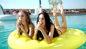 Video Stock Pretty Girls Eating Ice Cream On Pool Floats Live Wallpaper Free