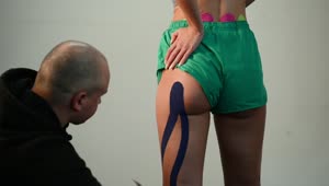 Video Stock Putting Kinesio Tape On The Leg And Gluteus Of An Live Wallpaper Free