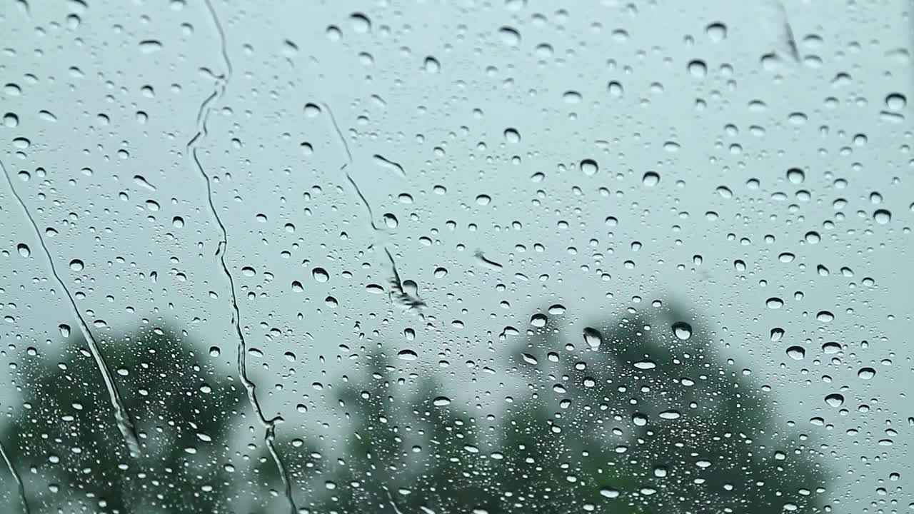 Download Video Stock Rain Falling On A Car Window Live Wallpaper Free
