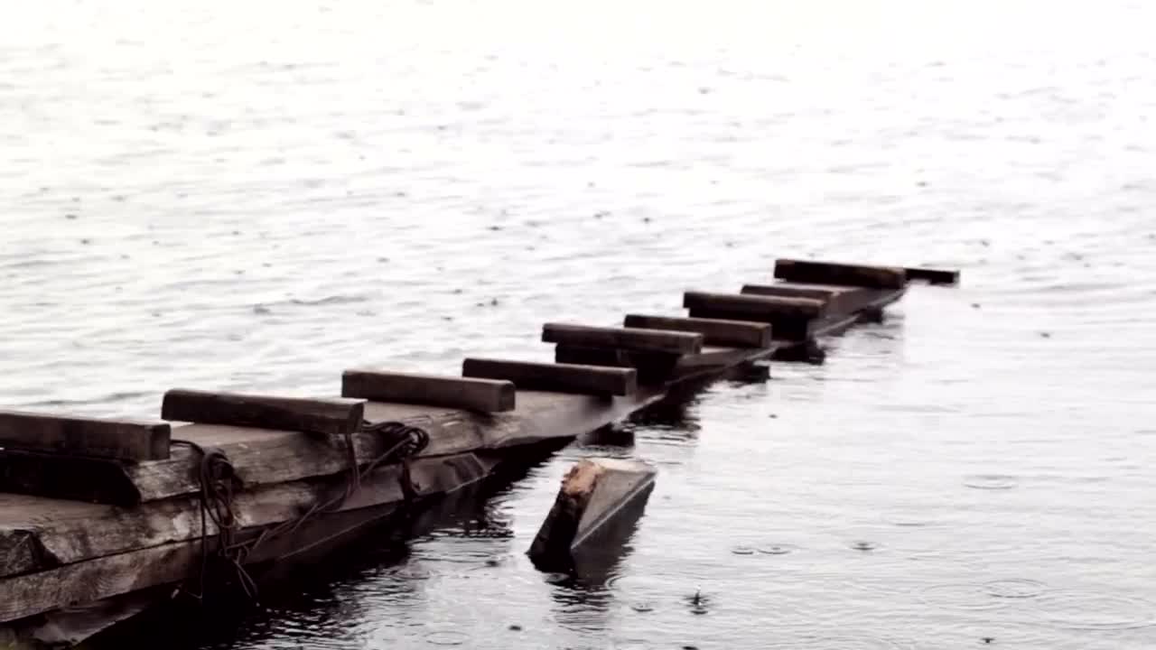 Download Video Stock Rain Falling On An Old Pier Live Wallpaper Free