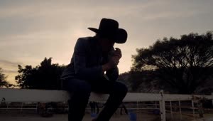 Video Stock Rancher Smoking At Sunset Live Wallpaper Free