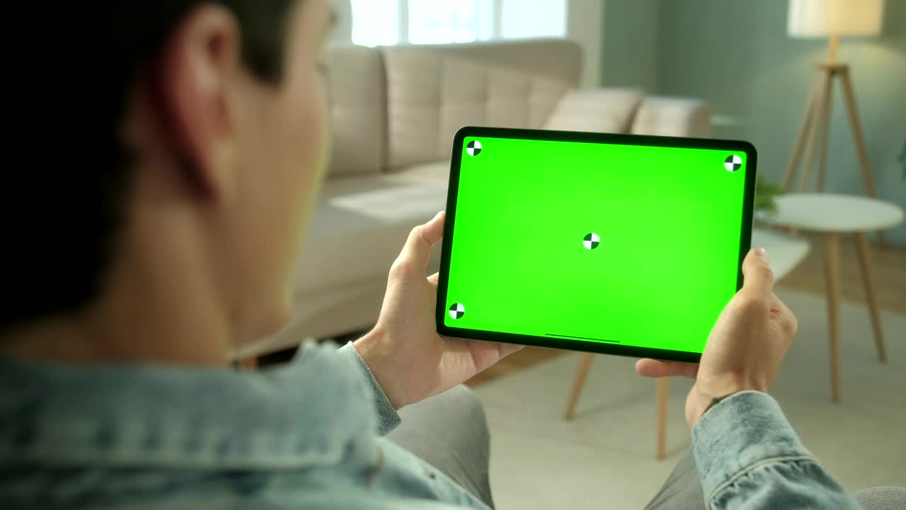Download Video Stock Rear View Of Green Screen Tablet Swipe In Living Room Live Wallpaper Free