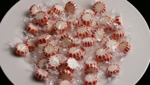 Video Stock Red Candy Wrapped In A Spinning Bowl Live Wallpaper Free