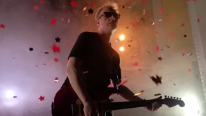 Video Stock Red Confetti Stars Fall On Performing Guitarist Live Wallpaper Free