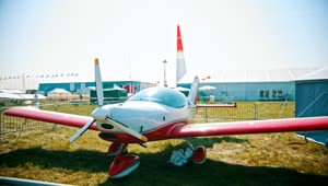 Video Stock Red Plane Parked On A Display In A Field Live Wallpaper Free