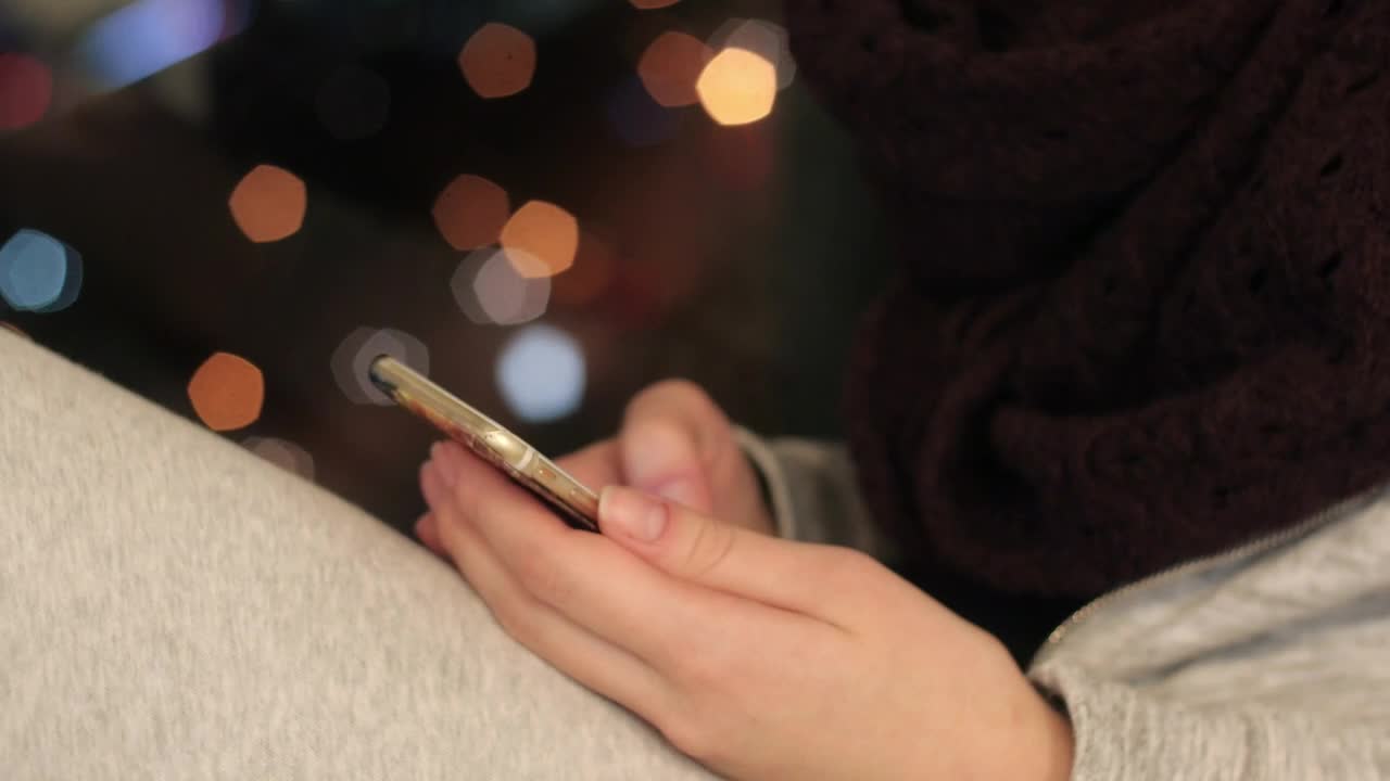 Download Free Stock Video Sitting By A Window Using A Phone Live Wallpaper