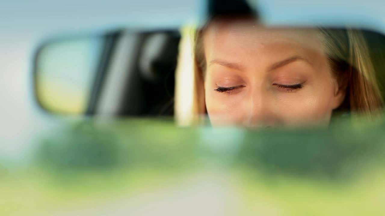 Download Free Stock Video Reflection Of A Woman In The Rear View Mirror Live Wallpaper