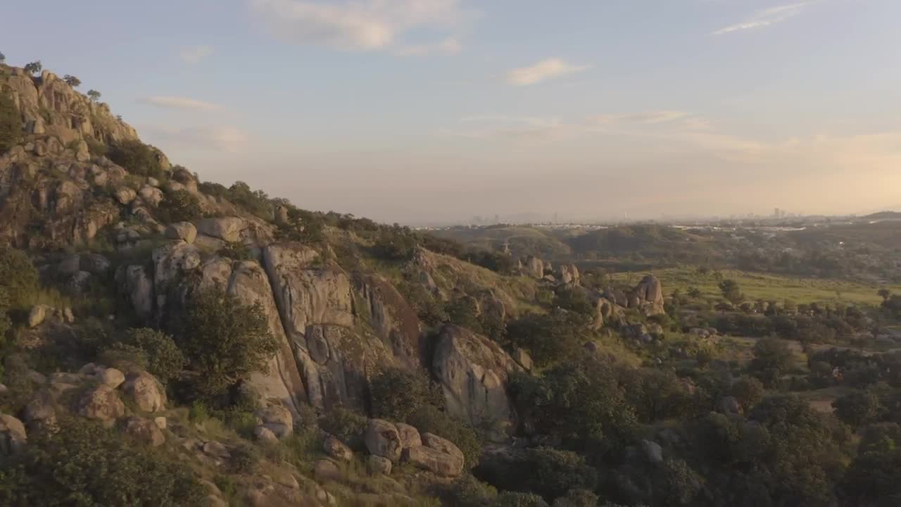 Download Free Stock Video Rocky Mountain Covered With Trees Seen From Above Live Wallpaper