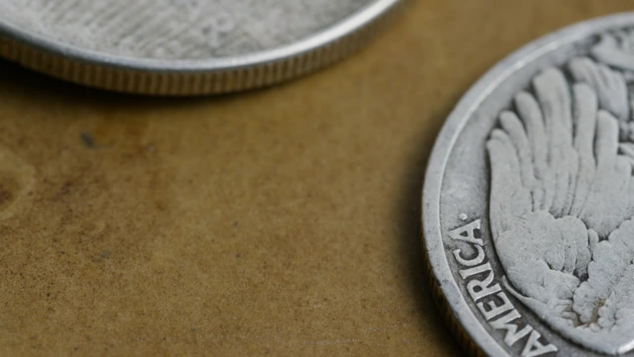 Download Free Stock Video Rotating Close Up Footage Of Coins On The Table Live Wallpaper
