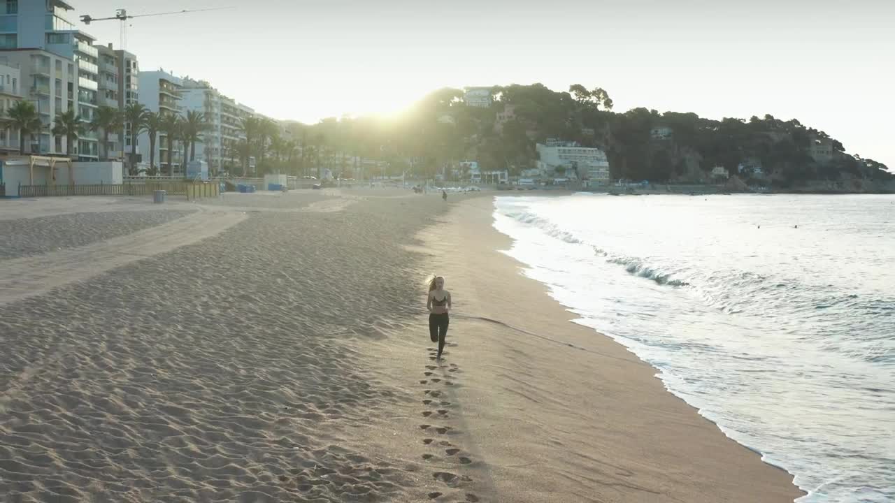 Download Free Stock Video Running Along A Town Beach Live Wallpaper
