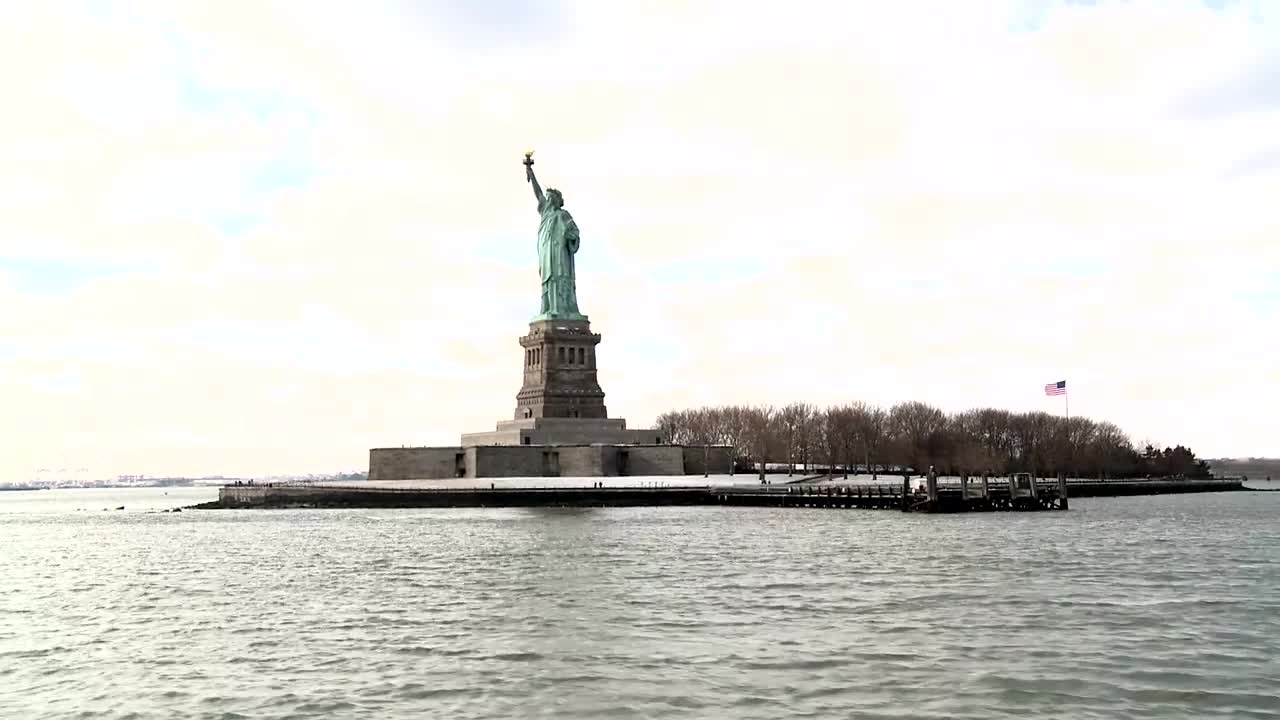 Download Free Stock Video Sailing By The Statue Of Liberty In A Cloudy Day Live Wallpaper