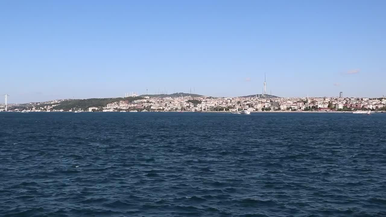 Download Free Stock Video Sailing The Sea Near The Shore Of A City Live Wallpaper