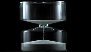 Free Stock Video Sand Falling From An Hourglass On A Black Background Live Wallpaper