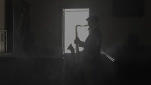 Free Stock Video Saxophonist Silhouette Playing Music In A Dark Room Live Wallpaper