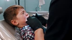 Free Stock Video Scared Little Boy Getting His Teeth Done With The Dentist Live Wallpaper