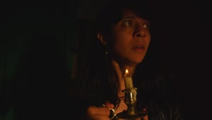 Free Stock Video Scared Woman In A Dark Place With A Candle In Live Wallpaper