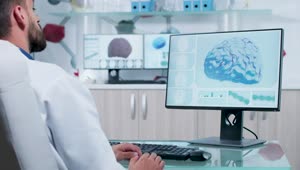 Free Stock Video Scientist Looks At D Brain Model On Computer Screen Live Wallpaper