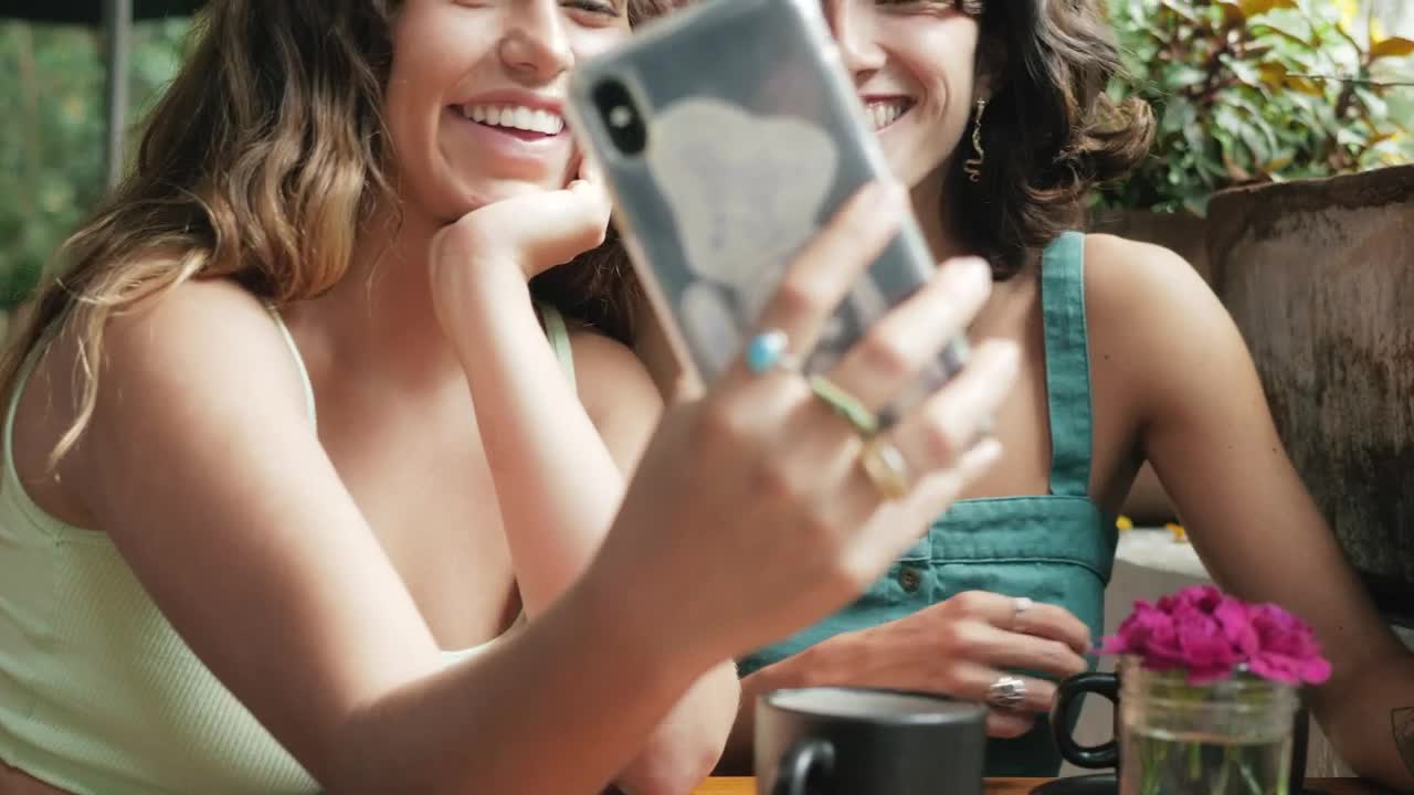 Download Free Stock Video Selfie Between Two Friends In A Coffee Shop Live Wallpaper
