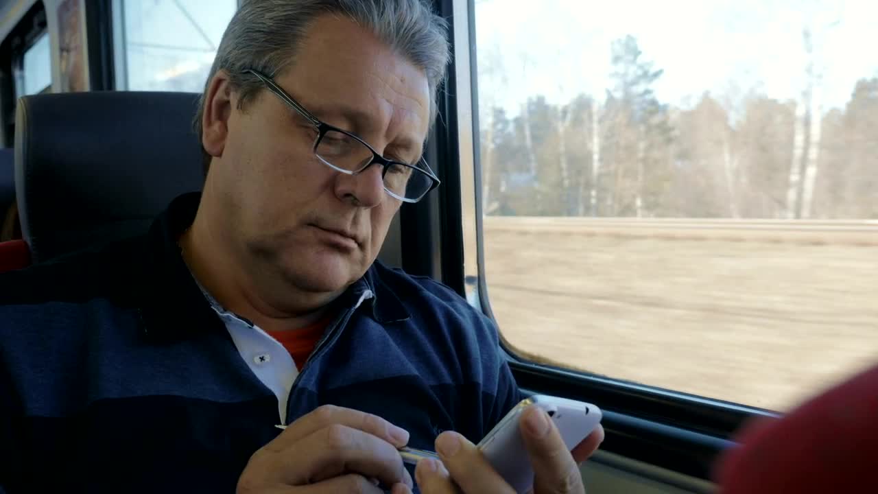 Download Free Stock Video Senior Man Using His Phone Live Wallpaper