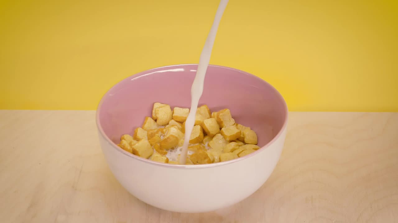 Download Free Stock Video Serving Milk In A Bread Shaped Cereal Bowl Live Wallpaper