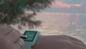 Free Stock Video Setting Up A Smartwatch At The Beach Live Wallpaper