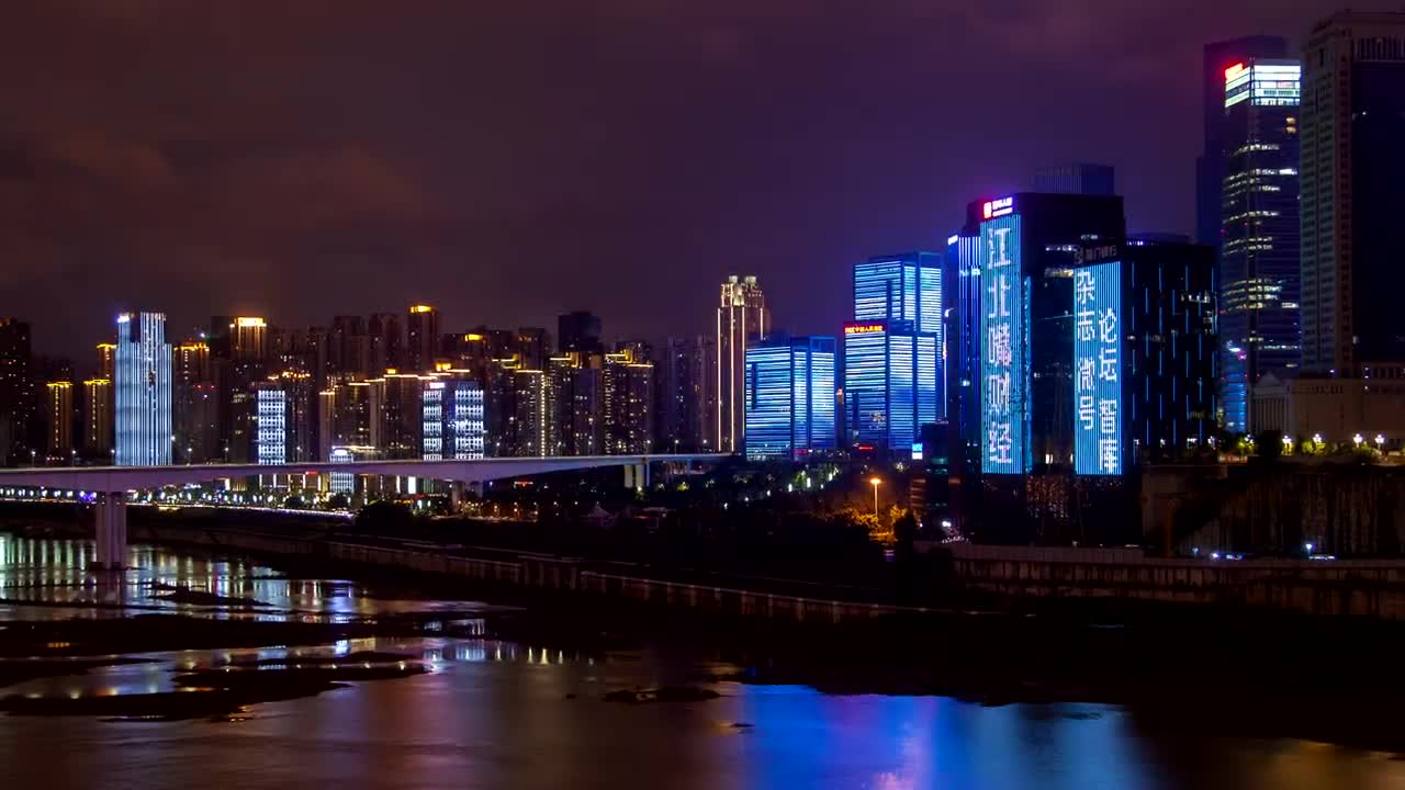 Download Free Stock Video Shining Buildings In A City With A River At Night Live Wallpaper
