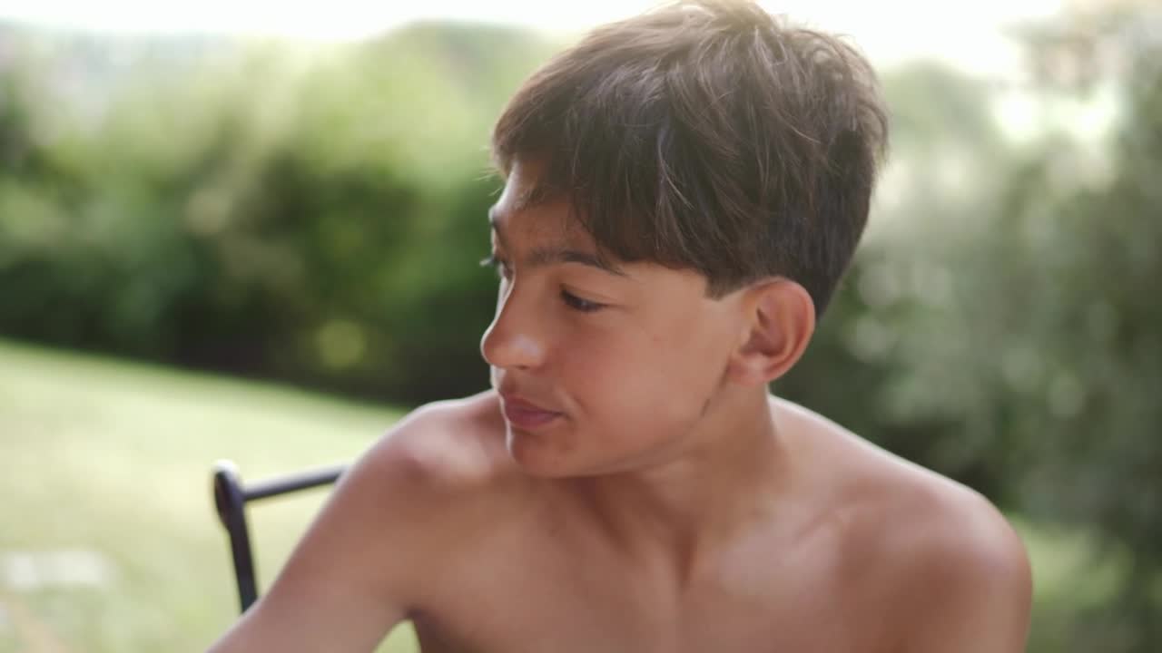 Download Free Stock Video Shirtless Boy Eating Breakfast Outside Live Wallpaper