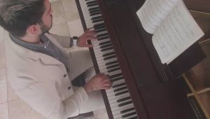 Free Stock Video Shot From Above Of A Musician Playing A Grand Piano Live Wallpaper