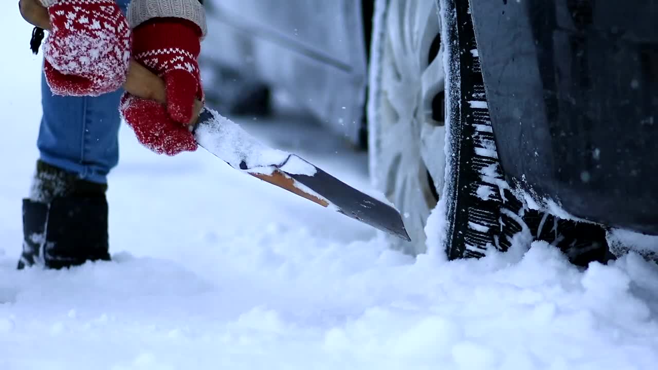 Download Free Stock Video Shovelling Snow From Under A Car Live Wallpaper