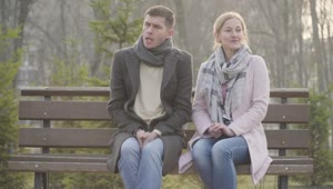Free Stock Video Shy Couple Sit Silent On Park Bench On Cold Day Live Wallpaper
