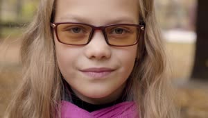 Free Stock Video Shy Little Girl In Glasses Looks Up To Camera Live Wallpaper