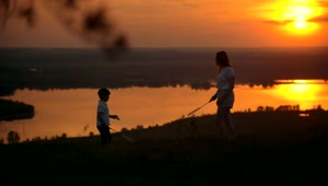 Free Stock Video Siblings Playing Badminton In The Sunset Live Wallpaper