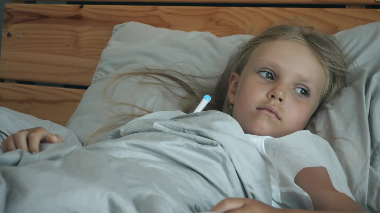Download Free Stock Video Sick Girl With A Thermometer In Bed Live Wallpaper
